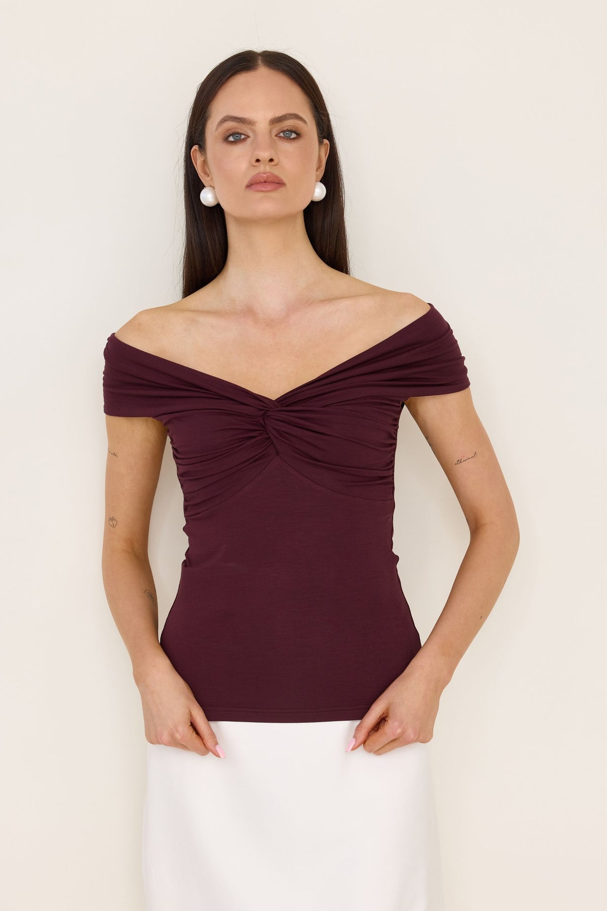 Red off-the-shoulder blouse with a roll-up