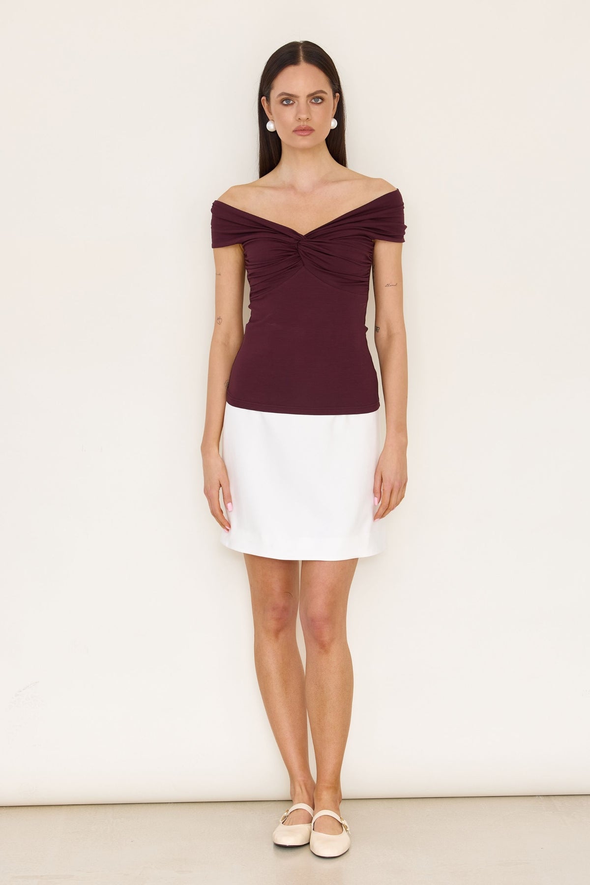 Red off-the-shoulder blouse with a roll-up