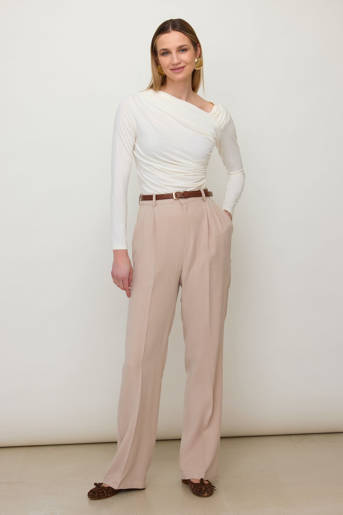 Brown long sleeve blouse with asymmetric neckline and draping