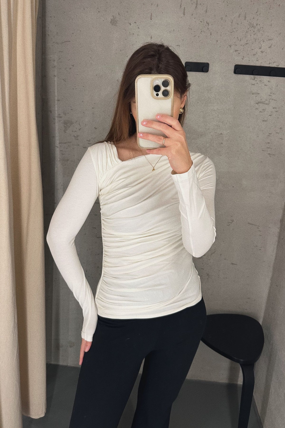 Brown long sleeve blouse with asymmetric neckline and draping