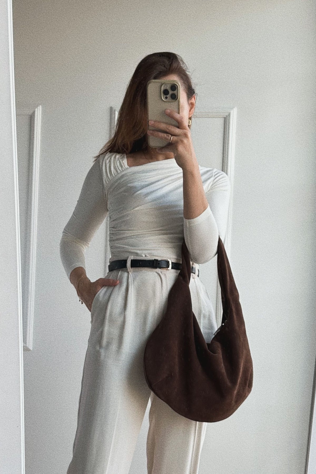 Brown long sleeve blouse with asymmetric neckline and draping